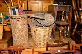 FOUR VARIOUS WICKER BASKETS with contents, together with a smokers stand (sd) (10)