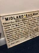 A CAST IRON MIDLAND RAILWAY TRESPASS NOTICE, black lettering on white background, has been
