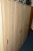 A FIVE PIECE MODERN BEDROOM SUITE comprising of a three section wardrobe and two chest of drawers