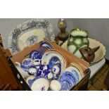 A BOX OF BLUE AND WHITE CHINA AND SUNDRY ITEMS to include a large platter, brass oil lamp, jug and