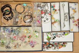 A BOX OF COSTUME JEWELLERY to include mainly glass charms of varying colours and designs, charm bead