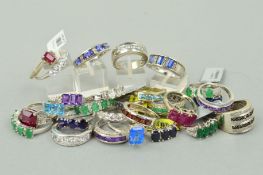 TWENTY SEVEN MAINLY GEM SET RINGS to include a five stone oval emerald ring interspaced by