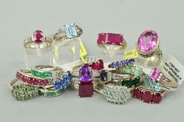 TWENTY MAINLY GEM SET RINGS to include a rectangular ruby three stone ring, an oval amethyst ring