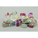 TWENTY MAINLY GEM SET RINGS to include a rectangular ruby three stone ring, an oval amethyst ring