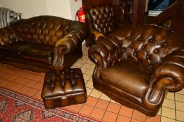A THOMAS LLOYD BROWN LEATHER FOUR PIECE CHESTERFIELD LOUNGE SUITE, comprising of a two seater
