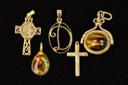 FIVE PENDANTS to include a cross pendant, an openwork initial D pendant, a scrolling cross pendant