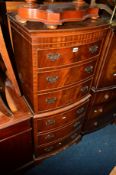 A TALL NARROW REPRODUCTION MAHOGANY BOW FRONT CHEST OF SIX GRADUATING DRAWERS on bracket feet,