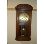 A MID 20TH CENTURY OAK WALL CLOCK