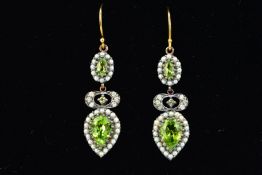 A PAIR OF PERIDOT AND SEED PEARL EARRINGS, each designed as a pear shape peridot within a seed pearl
