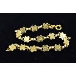 A 9CT GOLD FANCY DECORATED PANEL BRACELET measuring approximately 170mm in length, partial