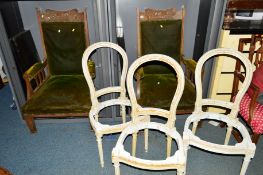 A PAIR OF EDWARDIAN ART NOUVEAU CARVED OAK PARLOUR CHAIRS with green velour upholstery, together