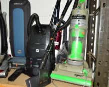 A ORECK XL10 UPRIGHT VACUUM CLEANER, a Dyson DC04 vacuum cleaner and two other vacuum cleaners (4)