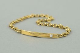 A LATE 20TH CENTURY 9CT GOLD DIAMOND SET IDENTITY PANEL BRACELET, a curved panel with a modern round