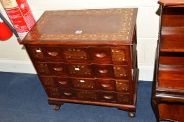 A SMALL REPRODUCTION HARDWOOD AND FLORALLY BRASS INLAID CHEST of four long drawers on cabriole legs,