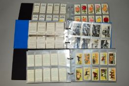 A CIGARETTE CARD COLLECTION, in three ring binder albums featuring a complete Will's album with a '