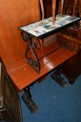 A 20TH CENTURY MAHOGANY TOPPED CAST IRON PUB TABLE, together with a wrought iron tile topped
