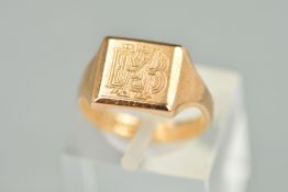 A MID VICTORIAN 9CT GOLD SIGNET RING, the central square panel engraved with a monogram, with a