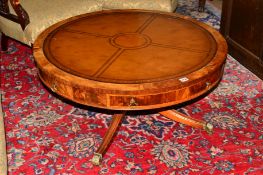 A REPRODUCTION MAHOGANY DRUM TABLE, the top with brown tooled leather inlay top, single drawer on