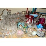 A QUANTITY OF CUT/COLOURED GLASSWARES, to include decanters, drinking glasses, vases, paperweights