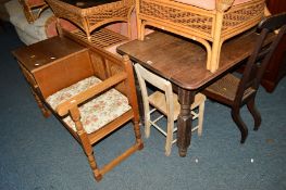 AN OAK LINENFOLD TELEPHONE TABLE/SEAT, an oak table, an oak cane seated prayer chair and another