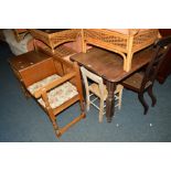 AN OAK LINENFOLD TELEPHONE TABLE/SEAT, an oak table, an oak cane seated prayer chair and another