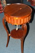 AN EDWARDIAN MAHOGANY CIRCULAR JARDINIERE STAND, on a shaped stand united by an undertier