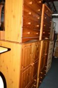 TWO PINE TWO DOOR WARDROBES above three drawers and two various pine chest of drawers (4)