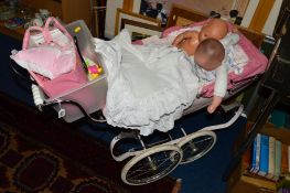 A PINK SILVER CROSS CHILD'S PRAM, together with dolls clothes etc, to include Zapfi Creation doll