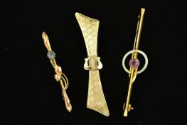 THREE EARLY 20TH CENTURY GOLD BROOCHES, the first of bow shape outline with diamond engraved pattern