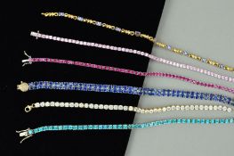 SIX GEM SET BRACELETS to include a two row, oval sapphire bracelet, a colourless cubic zirconia