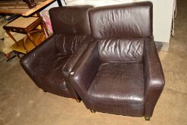 A PAIR OF BROWN LEATHERETTE ARMCHAIRS