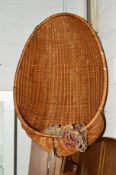 A WICKER HANGING EGG CHAIR
