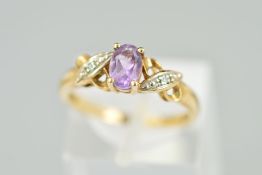A 9CT GOLD AMETHYST AND DIAMOND DRESS RING designed as a central amethyst to the cross design