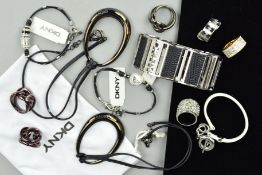 ELEVEN ITEMS OF DKNY JEWELLERY to include three knot design rings, a chain ring, a large pendant
