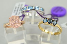 THREE GOLD GEM SET RINGS to include an 18ct yellow gold lliana three stone indicolite ring, the