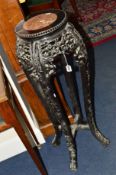 A 19TH CENTURY ORIENTAL CARVED ROSEWOOD TORCHERE STAND, the fretwork detail with flower head and