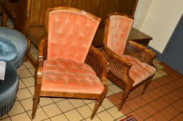 A PAIR OF MAHOGANY BERGERE ARMCHAIRS with buttoned orange upholstery