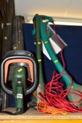 A BLACK AND DECKER ELECTRIC HEDGE TRIMMER, a Black and Decker strimmer and a Bosch strimmer (3)