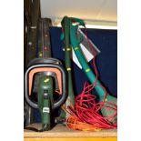 A BLACK AND DECKER ELECTRIC HEDGE TRIMMER, a Black and Decker strimmer and a Bosch strimmer (3)