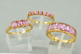 THREE 9CT GOLD PINK SAPPHIRE DRESS RINGS to include a pink and white sapphire half eternity ring,