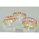 THREE 9CT GOLD PINK SAPPHIRE DRESS RINGS to include a pink and white sapphire half eternity ring,