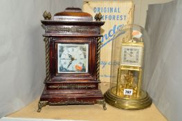 A BOXED KUNDO BLACK FORREST 400 DAY GLASS DOMED CLOCK, in need of attention together with a quartz