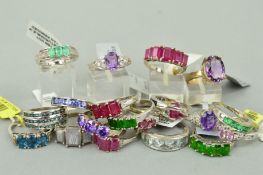 TWENTY MAINLY GEM SET RINGS to include an oval amethyst ring with white topaz shoulders, a five