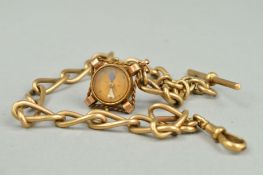 AN EARLY 20TH CENTURY LONG OPEN LINK SINGLE ALBERT CHAIN, together with a carnelian compass fob