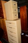 A TALL MODERN CHEST OF SIX DRAWERS and a matching three drawer bedside chest (2)