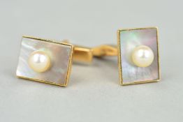 A PAIR OF GEM SET CUFFLINKS, each designed as rectangular mother of pearl panel set with a central