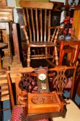 A MODERN STAINED BEECH STICK BACK ROCKING CHAIR, a Georgian oak rush seated ladder back chair and