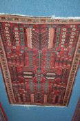 A 20TH CENTURY TURKISH WOOLLEN RED GROUND RUG, floral border, 200cm x 133cm, together with a similar