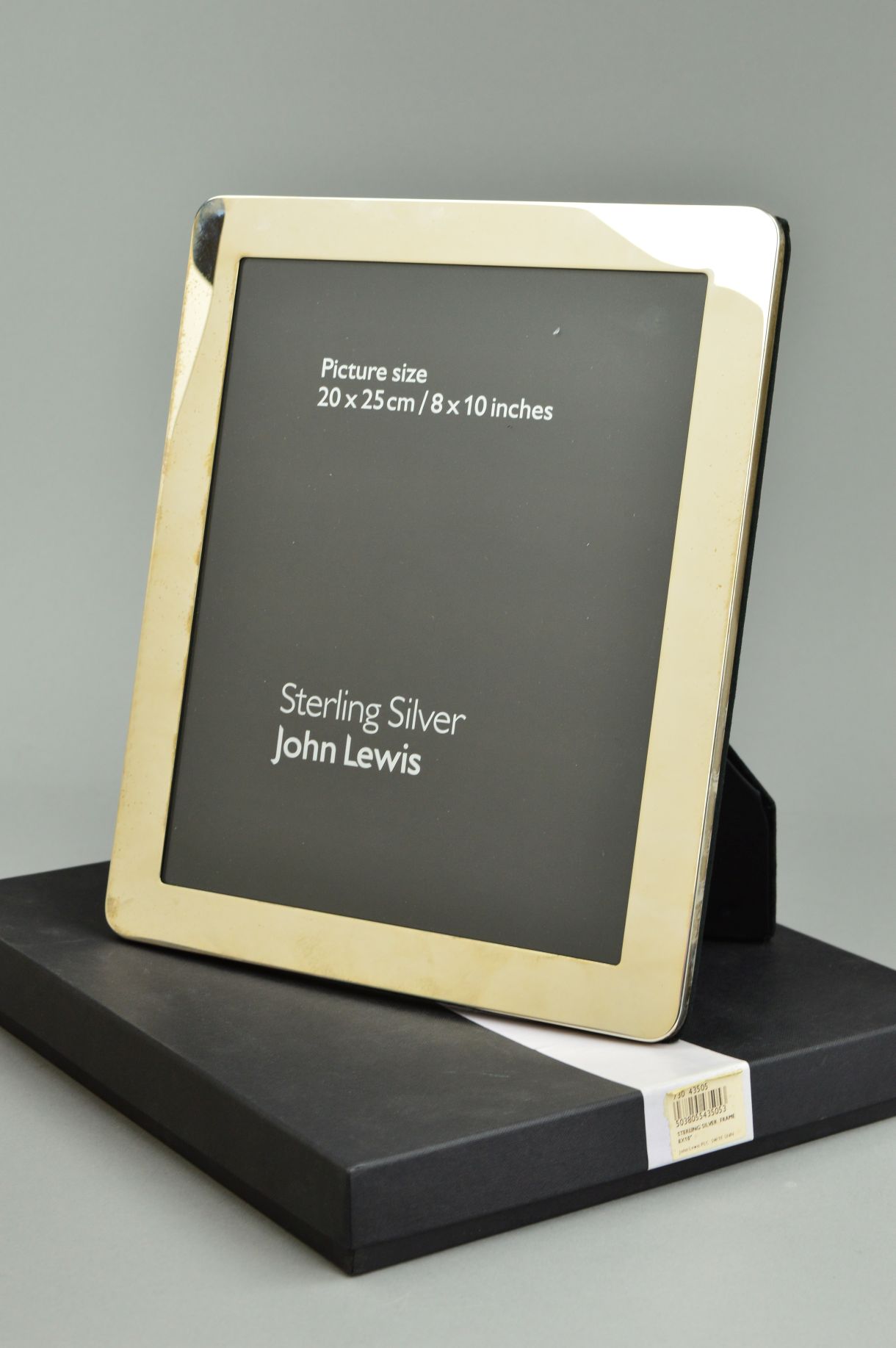 A BOXED JOHN LEWIS STERLING SILVER EASEL BACK, rectangular photograph frame, inner measurements 25cm