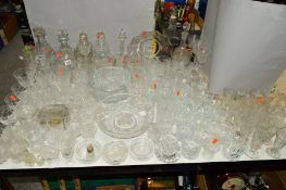 A QUANTITY OF CUT/ETCHED GLASSWARES to include decanters, bowls, glasses, etc